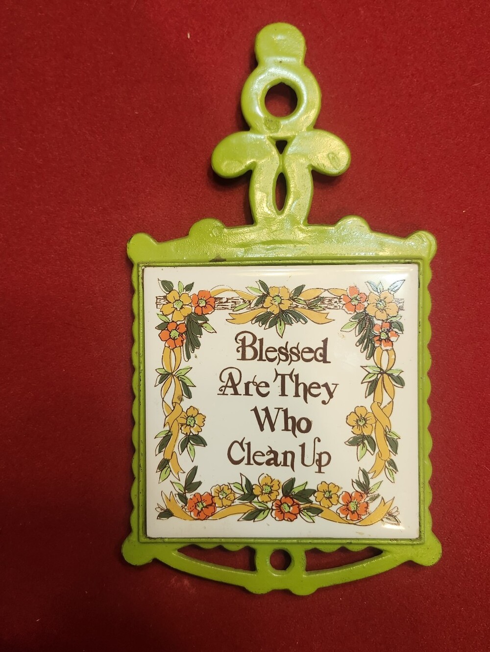vintage mid-century cast iron and ceramic tile trivet with a light green paint